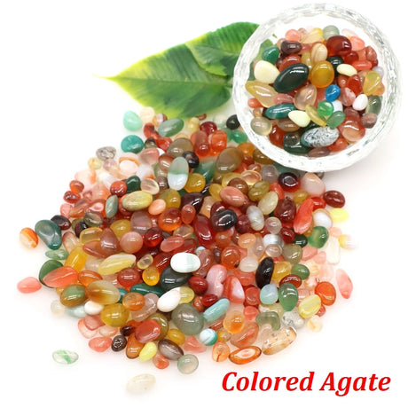 Colored Agate stones with a bowl of rocks on a white background.