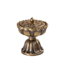 Bronze incense burner with intricate design on a white background