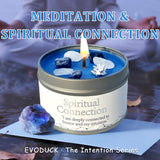 Candle in a tin labeled 'Spiritual Connection' with stones and a person in the background.