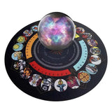 Decorative mat with zodiac signs and a crystal ball displaying a colorful nebula on a white background