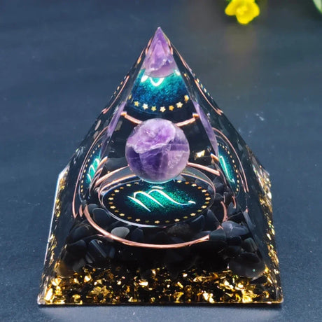 Crystal pyramid with purple sphere and glowing elements on a dark background