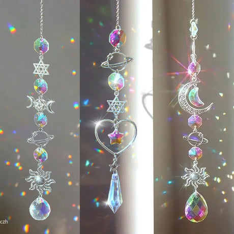 Decorative hanging crystal with celestial designs on a blurred background
