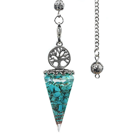 Turquoise crystal pendulum with silver tree of life design on a white background