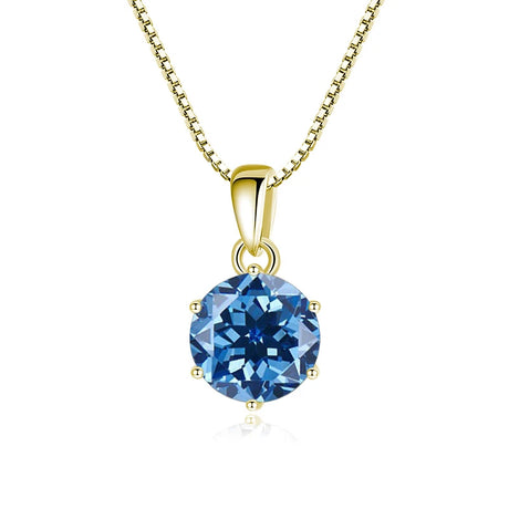 Gold pendant with a blue gemstone on a white background
