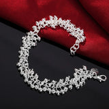 Silver bracelet on a black and red fabric background