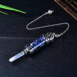 Crystal necklace with blue stones on a dark surface