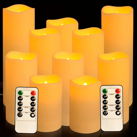 Set of LED candles with remote controls on a dark background