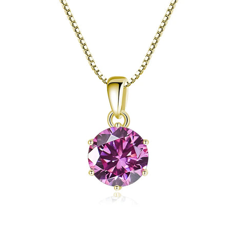 Gold pendant with a pink gemstone on a white background