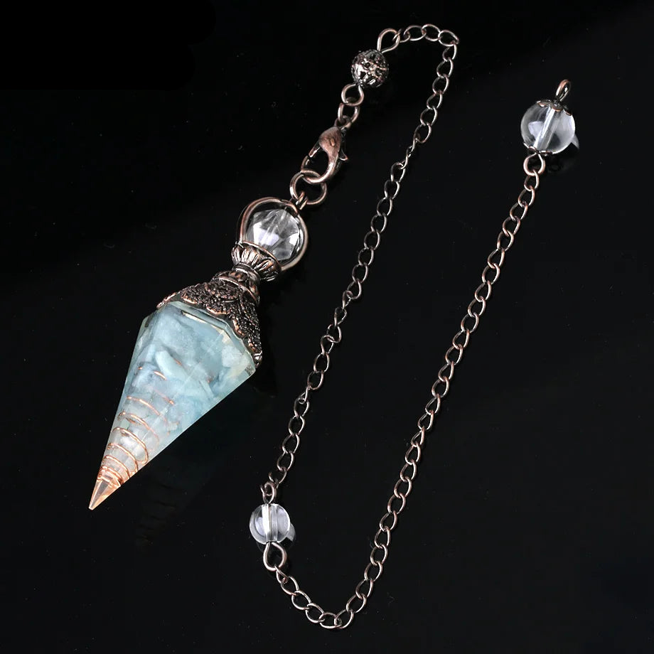 Jewelry set with a cone-shaped pendant and chain on a black background