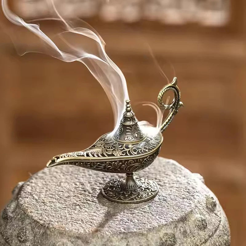Decorative oil lamp with smoke on a stone surface