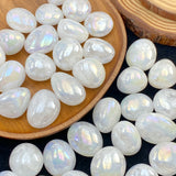 Pearl-like stones on a wooden plate with a dark background