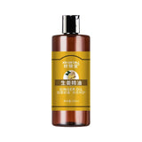 Bottle of ginger oil with a yellow label on a white background