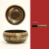 Tibetan singing bowl set with decorative elements on a white and red background
