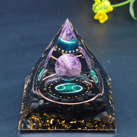 Crystal pyramid with a purple crystal on a dark background
