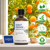 Bottle of sweet orange essential oil with a background of orange trees