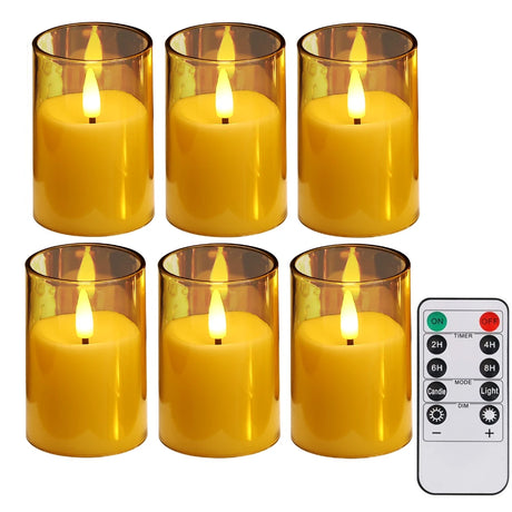 Set of six amber glass candles with a remote control on a white background
