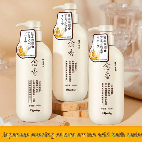 Three bottles of Japanese evening sakura amino acid bath series on a wooden surface with a blurred background.