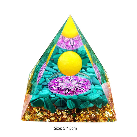 Triangular pyramid with colorful design and yellow balls on a white background