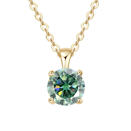 Gold necklace with a green gemstone pendant on a white background