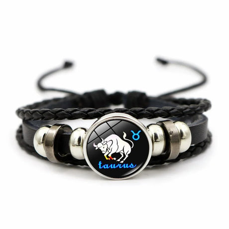 Black braided leather bracelet with Taurus zodiac sign charm on a white background