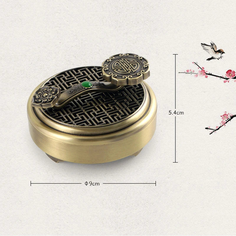 Bronze incense burner with intricate design on a light gray background
