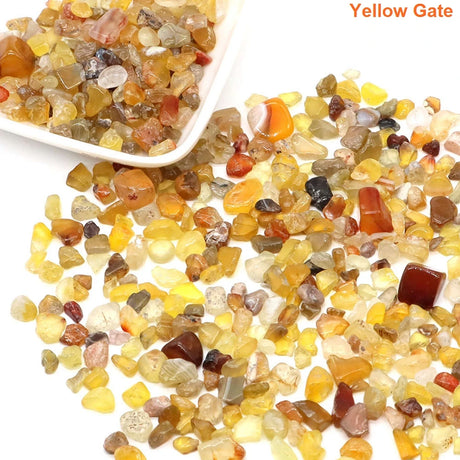 Colorful stones with a white scoop on a white background, labeled 'Yellow Gate'.
