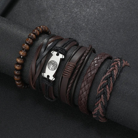 Collection of leather and beaded bracelets on a dark surface