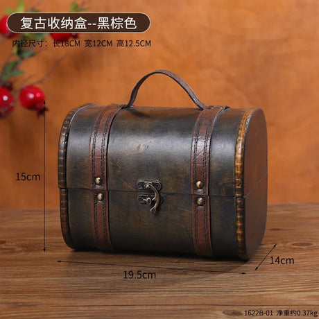 Vintage-style wooden box with measurements on a wooden surface