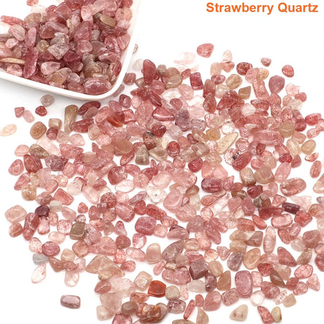 Strawberry quartz stones with a bowl of stones on a white background
