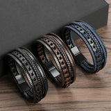 Three braided leather bracelets on a wooden surface with a dark background
