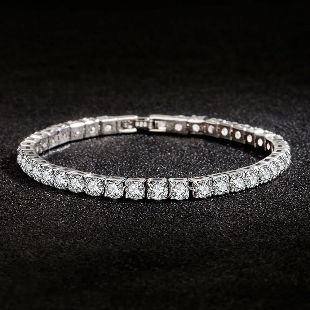 Silver bracelet with clear stones on a black background