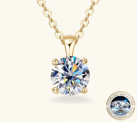 Gold necklace with a diamond pendant on a white background, featuring the Joyce Jewelry brand.