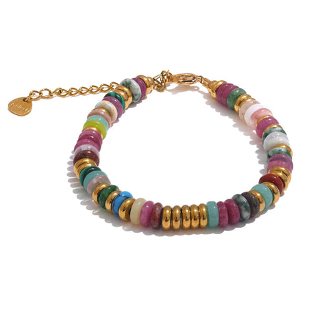 Multicolored beaded bracelet with gold accents on a white background