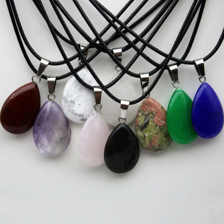 Necklaces with various colored teardrop pendants on a white background