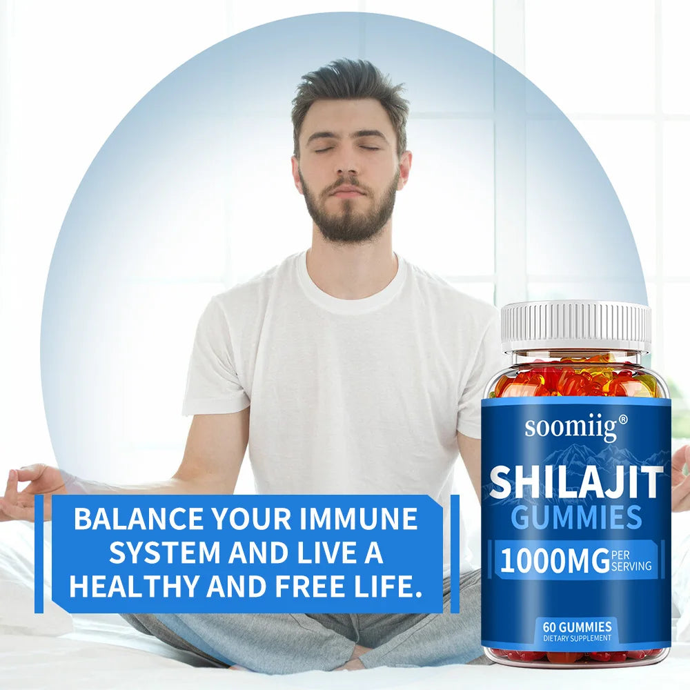 Person holding a bottle of soomiig Shilajit Gummies with text promoting immune system balance.