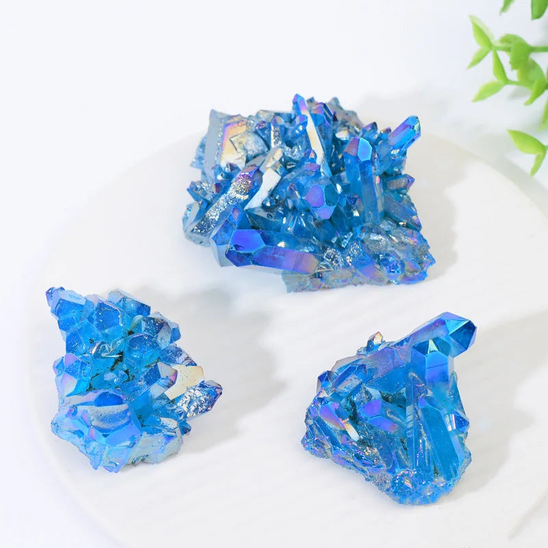 Three blue crystal formations on a white background