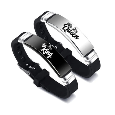 Pair of black and silver bracelets with 'Her King' and 'His Queen' text on a white background