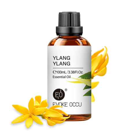 Ylang ylang essential oil bottle with flowers on a white background, featuring Evoke Occu branding.