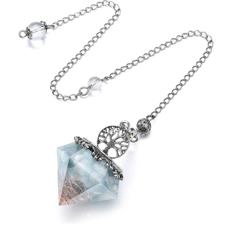 Necklace with a crystal pendant and tree of life charm on a white background