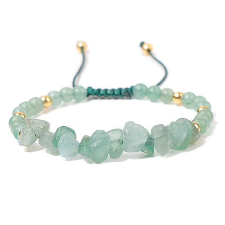 Green beaded bracelet with gold accents on a white background