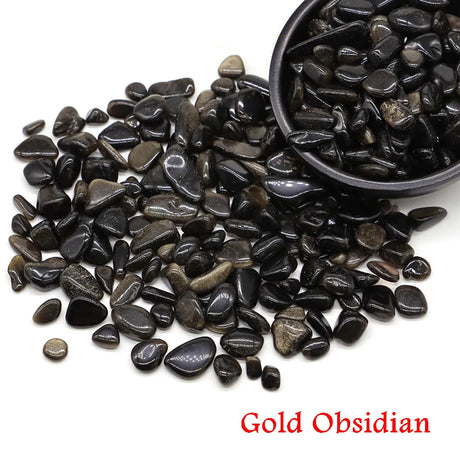 Gold Obsidian stones with a small bowl on a white background