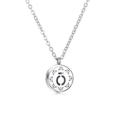 Silver necklace with a round pendant on a white background