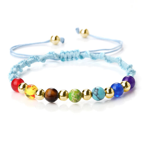 Colorful beaded bracelet with gold accents on a white background