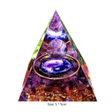 Triangular pyramid with crystal balls and yin yang symbol on a white background