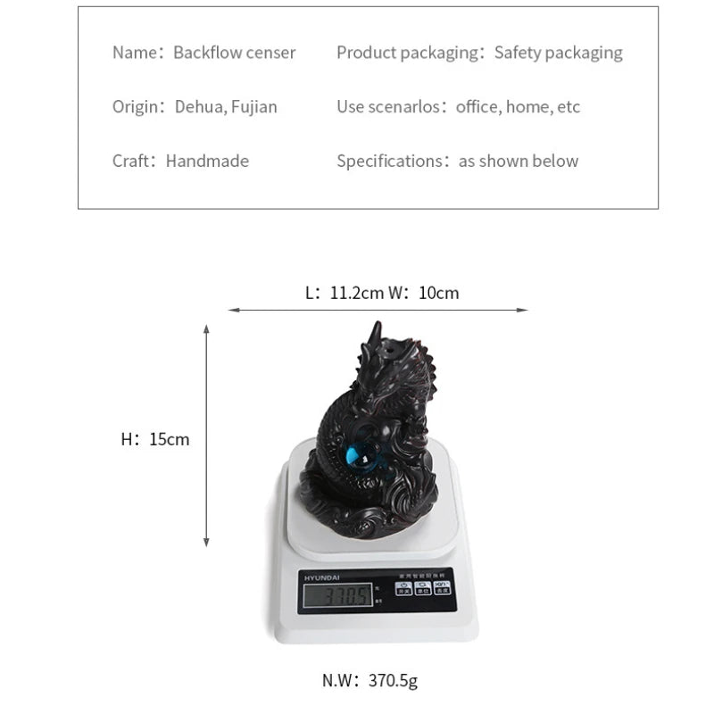 Black dragon-shaped object on a digital scale with dimensions and weight displayed.