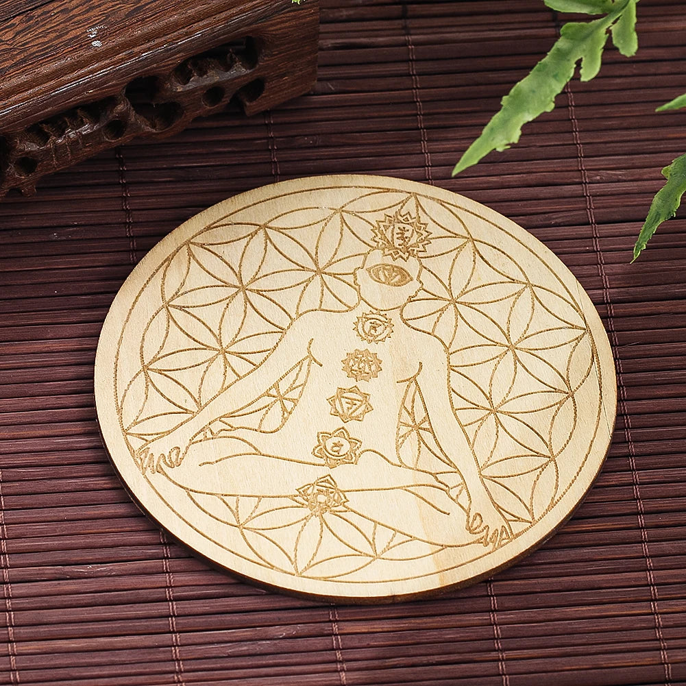 Wooden coaster with a geometric design of a woman and floral patterns on a wooden surface.