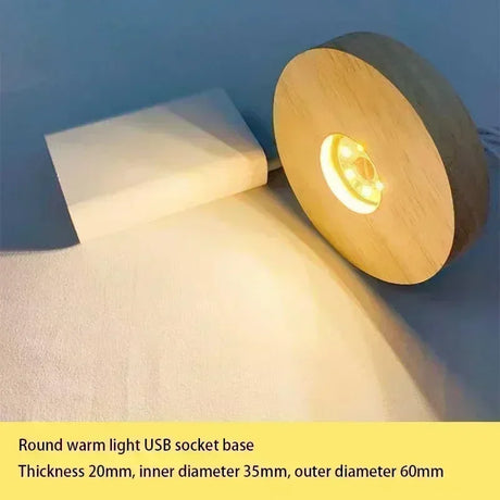 Round warm light USB socket base on a blue and white background