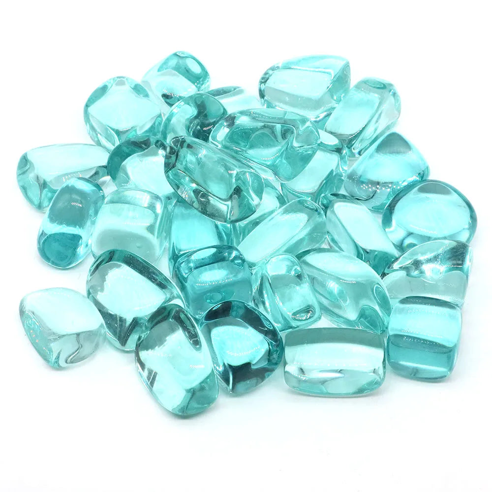 Turquoise glass gems on a white background
