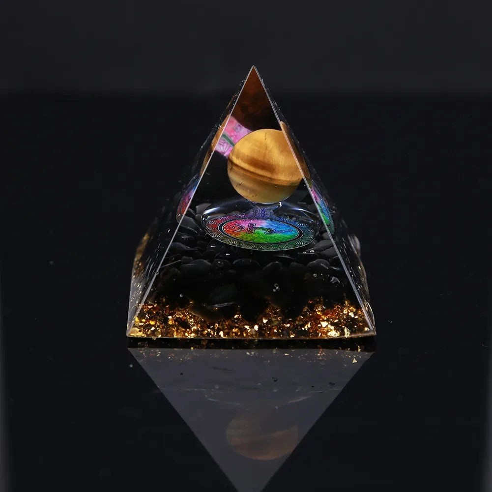 Pyramid-shaped object with a reflective surface displaying a colorful inner scene.