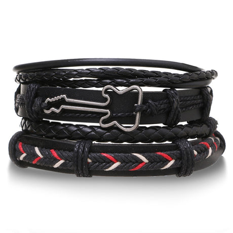 Multi-layered black leather bracelet with metal dog bone charm on a white background